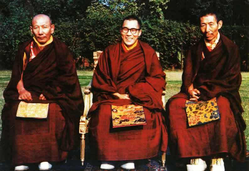 H.H. the Dalai Lama (middle) and his two main tutors. On the right side of H.H. the Dalai Lama sits Kyabje Ling Rinpoche, his senior tutor and on the left side sits Kyabje Trijang Rinpoche, his junior tutor.